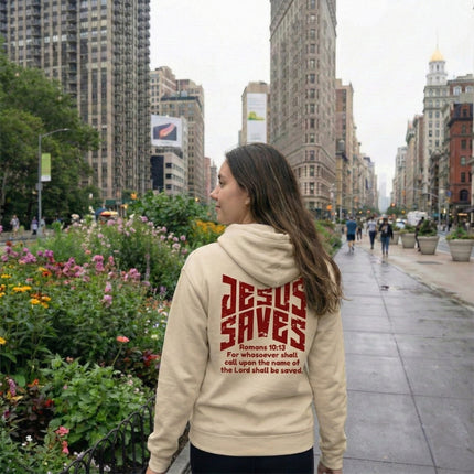 Person wearing a hoodie with 'Jesus Saves' text in an urban setting