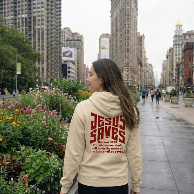 Person wearing a hoodie with 'Jesus Saves' text in an urban setting